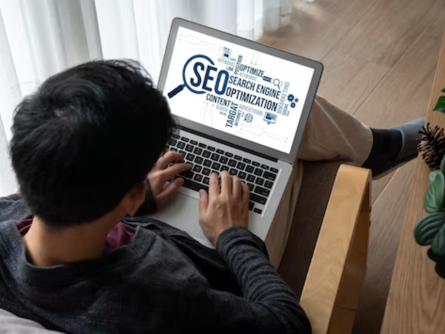 A man analyzing SEO keywords related to local seo versus traditional SEO strategies