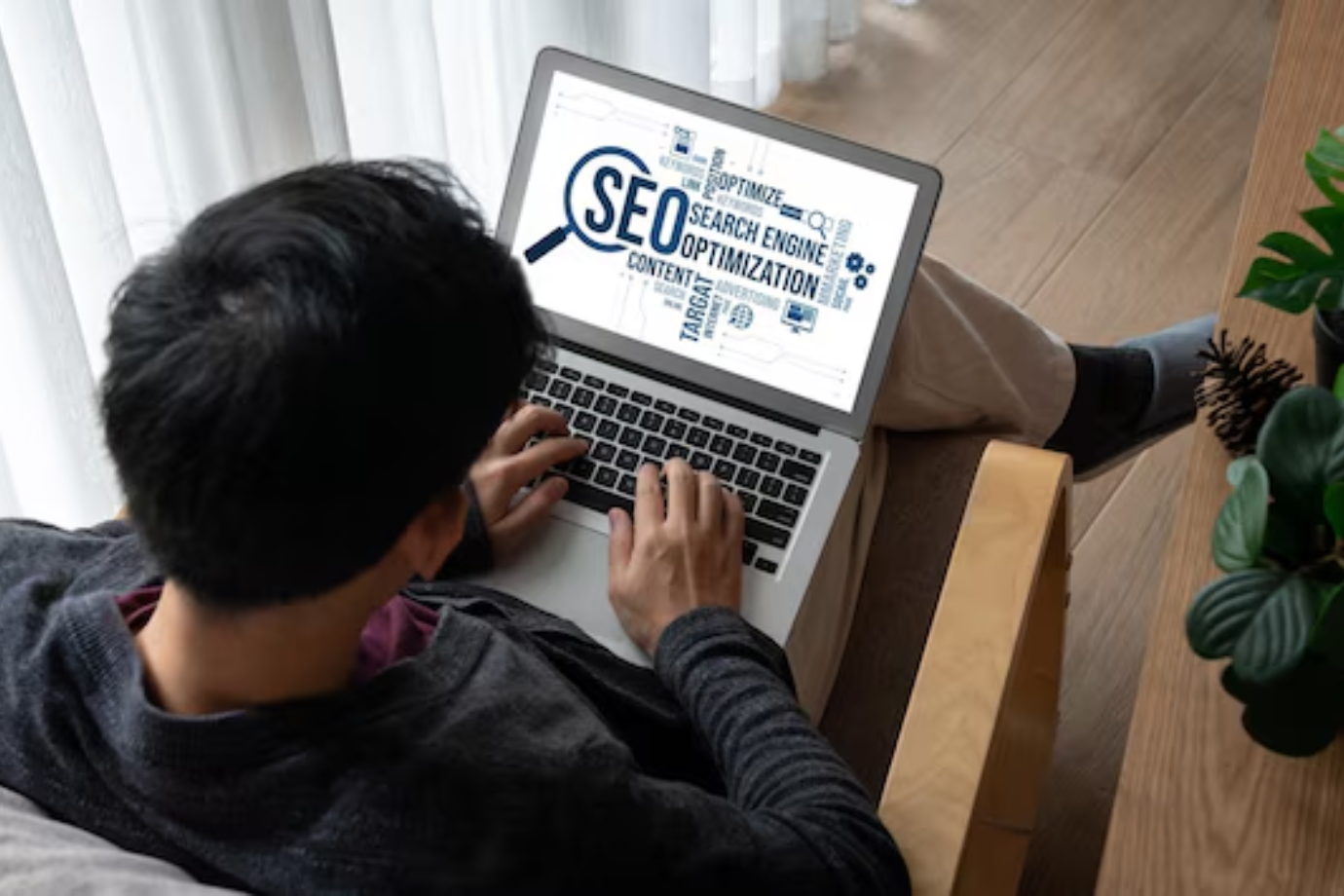 A man analyzing SEO keywords related to local seo versus traditional SEO strategies